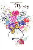 The artwork on this Mother's Day card shows an elegant, watercolour bouquet that seems to hover weightlessly on the page, like a fresh arrangement just lifted from a vase in a Paddington townhouse. At the centre, lush roses in shades of vivid pink and deep magenta open outward, their petals created with layered washes that bleed softly into one another, conveying fullness and tenderness. Nestled amidst these roses are smaller blue and lavender blossoms, their cooler tones soothing the eye and providing a gentle contrast that suggests calmness, similar to a quiet walk around Little Venice when the canal is still. Subtle gold detailing outlines select petals and leaf veins, catching the light and adding an air of refinement, as though the design had been carefully finished with metallic ink. The blooms rest in a soft, rounded vase wrapped with a ribbon, the bow rendered in relaxed, flowing lines that evoke the finishing touch a florist gives before a bouquet leaves the shop. All around, the crisp white background is enlivened by tiny splashes of pinks, purples, and blues, creating a sense of movement, joy, and celebration. The overall impression is light and airy yet emotionally rich, like receiving thoughtfully chosen flowers delivered to a doorstep off Praed Street. This card holds the feeling of spring and the reassurance of being loved, offering a lasting, painted gesture of gratitude and affection that a mother can keep long after a real bouquet from Florist Paddington has perfumed her home.